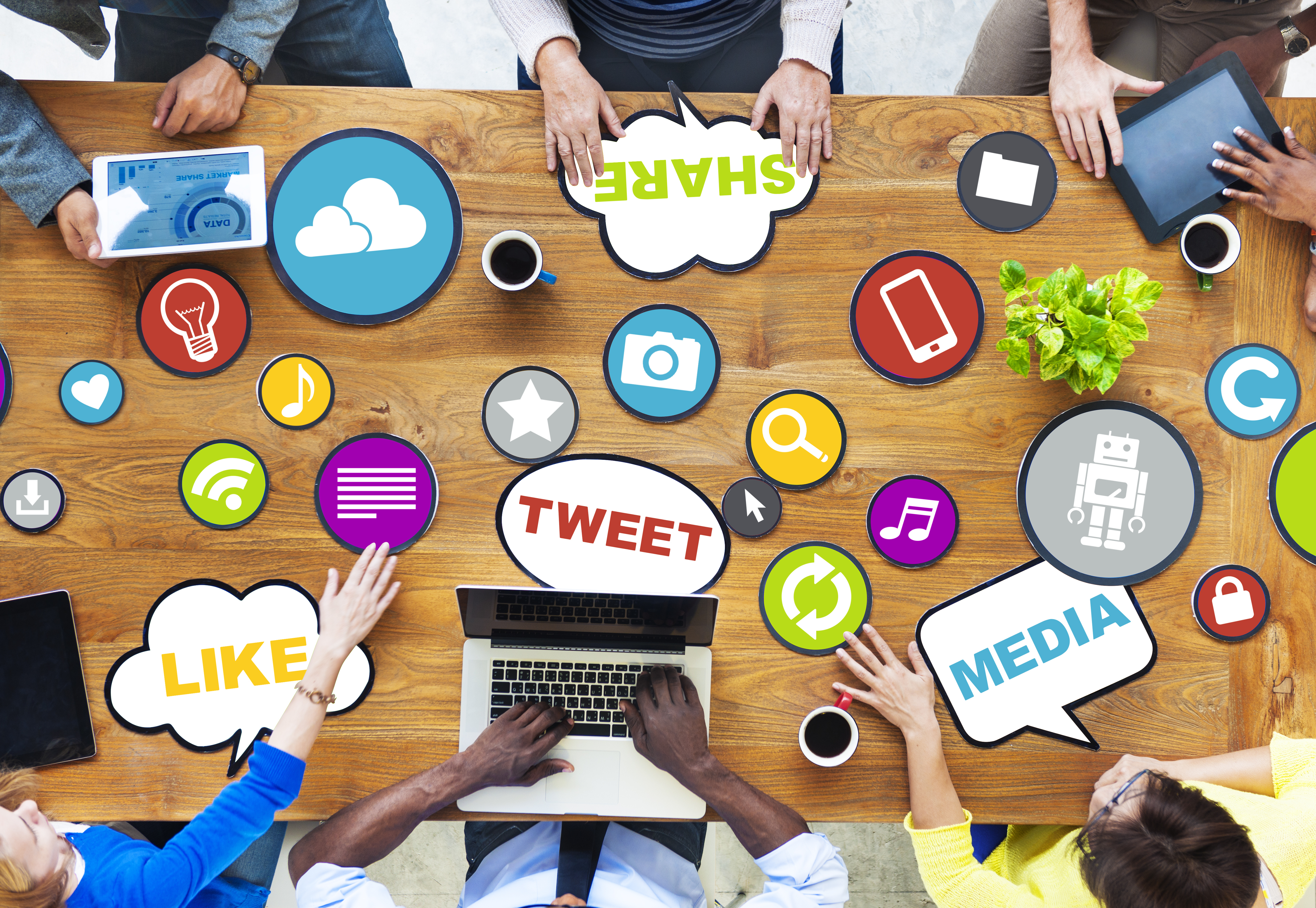 People around a table sharing ideas about Social Media.